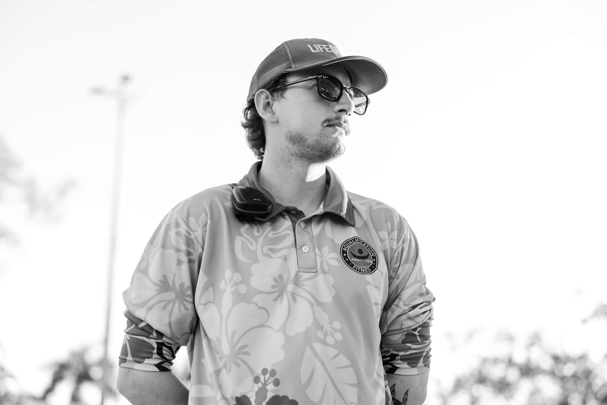 A website friendly image for a business featuring a a life guard looking over a large Olympic sized pool, ready to be used for website design in Rockhampton.