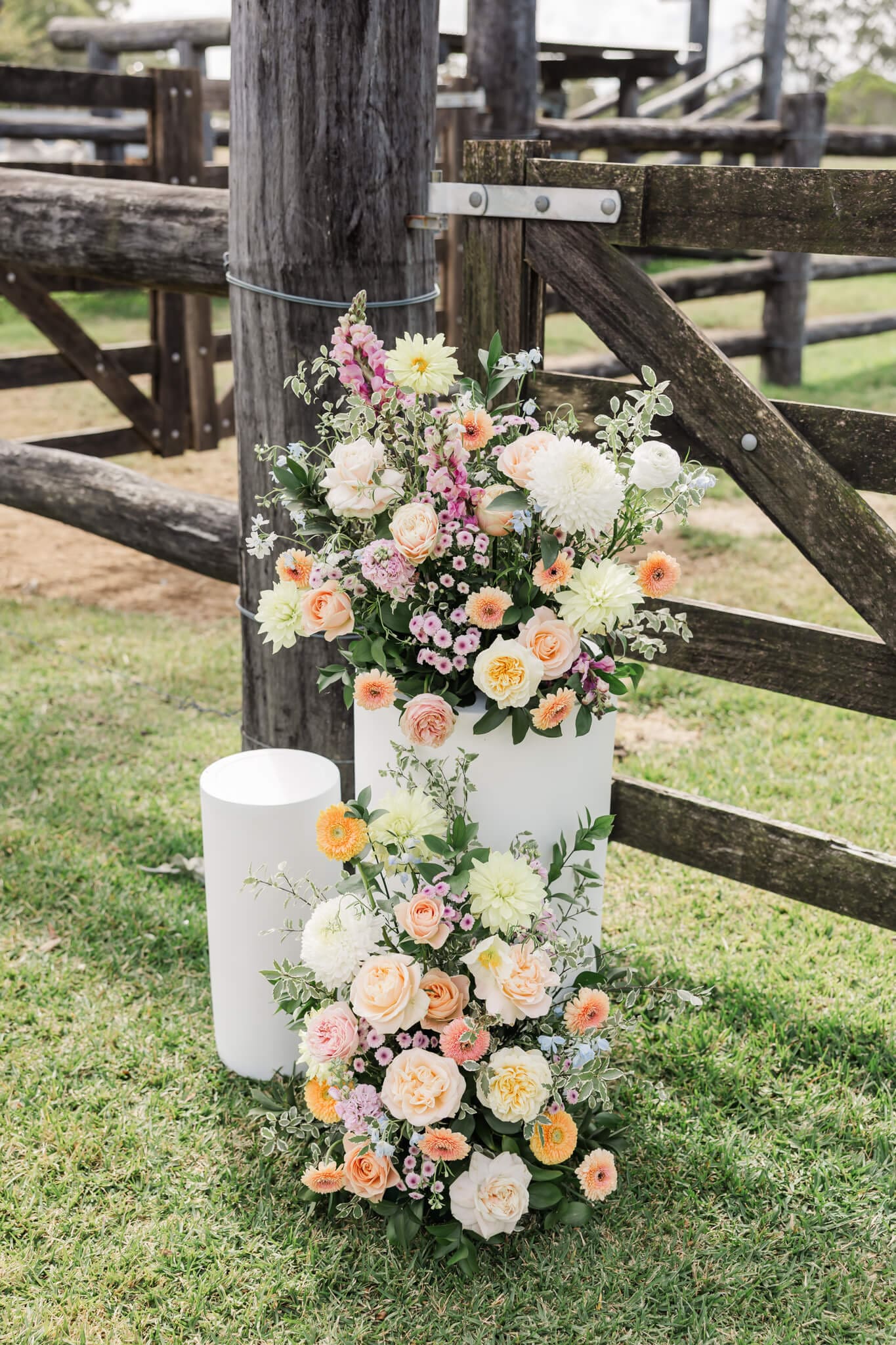 Stunning florals created by Dusty Bloom for a wedding ceremony site.