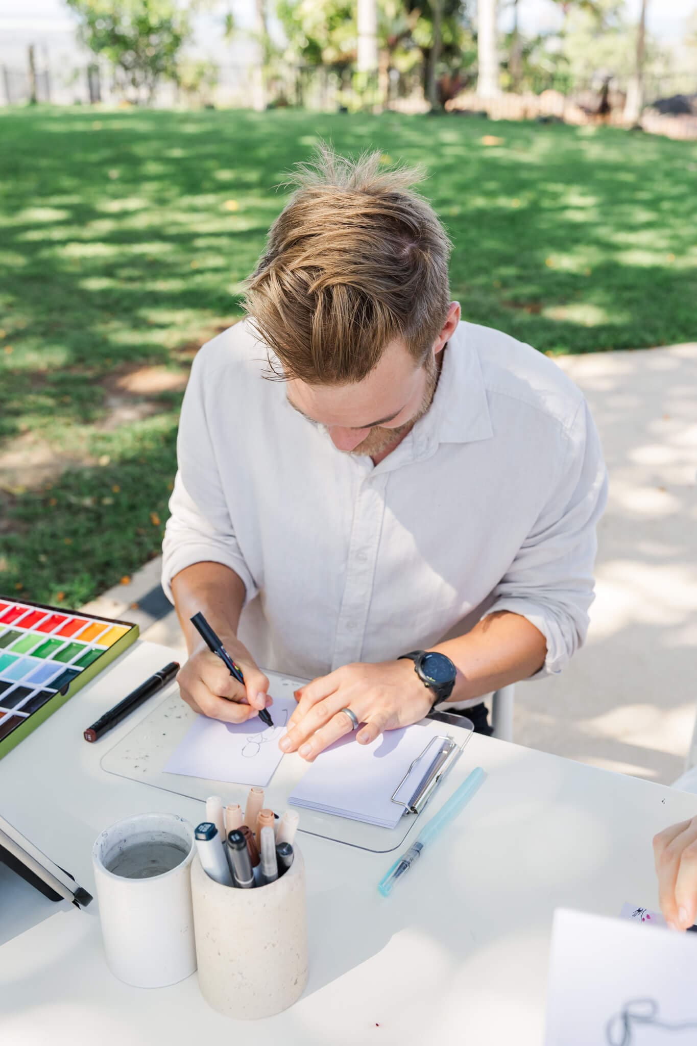 An artist doing live guest paintings at a Yeppoon wedding.