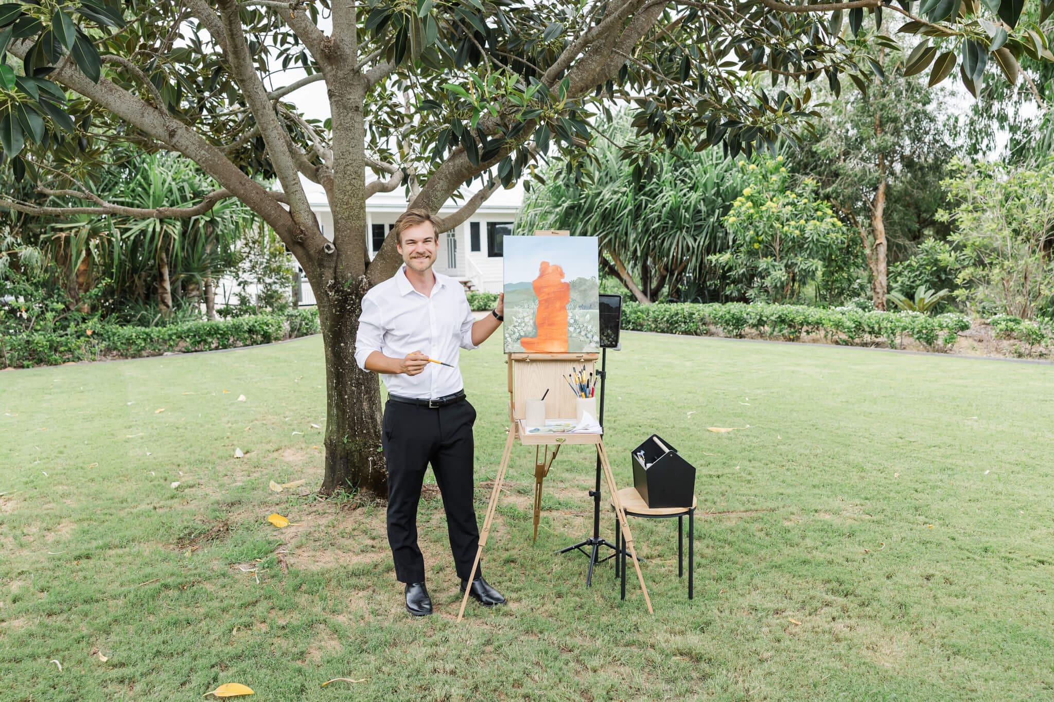 Art by Joel in action, painting a couple at  a Rockhampton and Yeppoon venue.