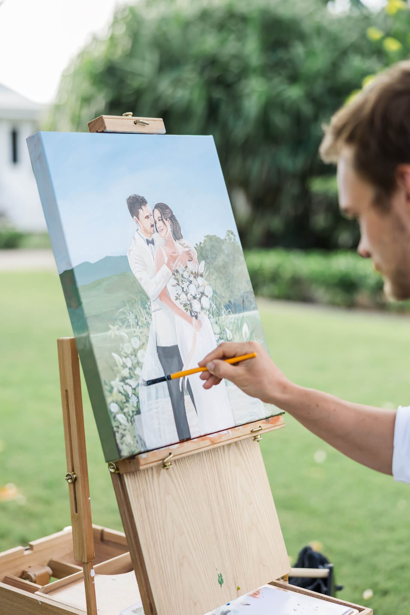 Art by Joel in action, painting a couple at  a Rockhampton and Yeppoon venue.