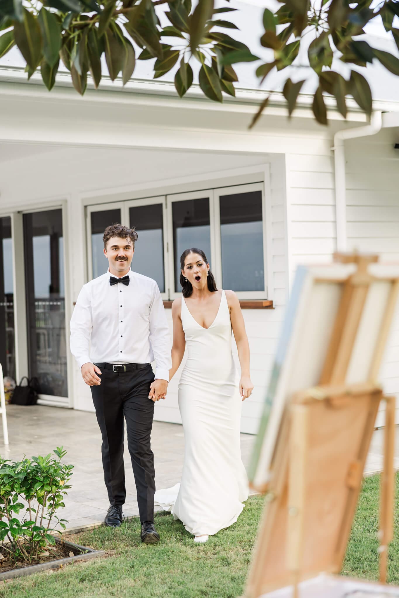 Bride and groom get a surprise when they see their art painting finished on their wedding day.
