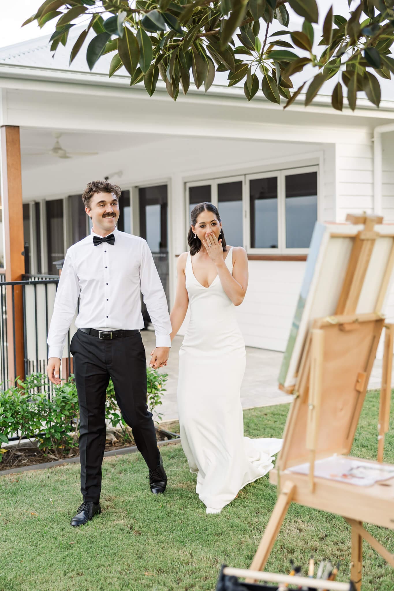 Bride and groom get a surprise when they see their art painting finished on their wedding day.
