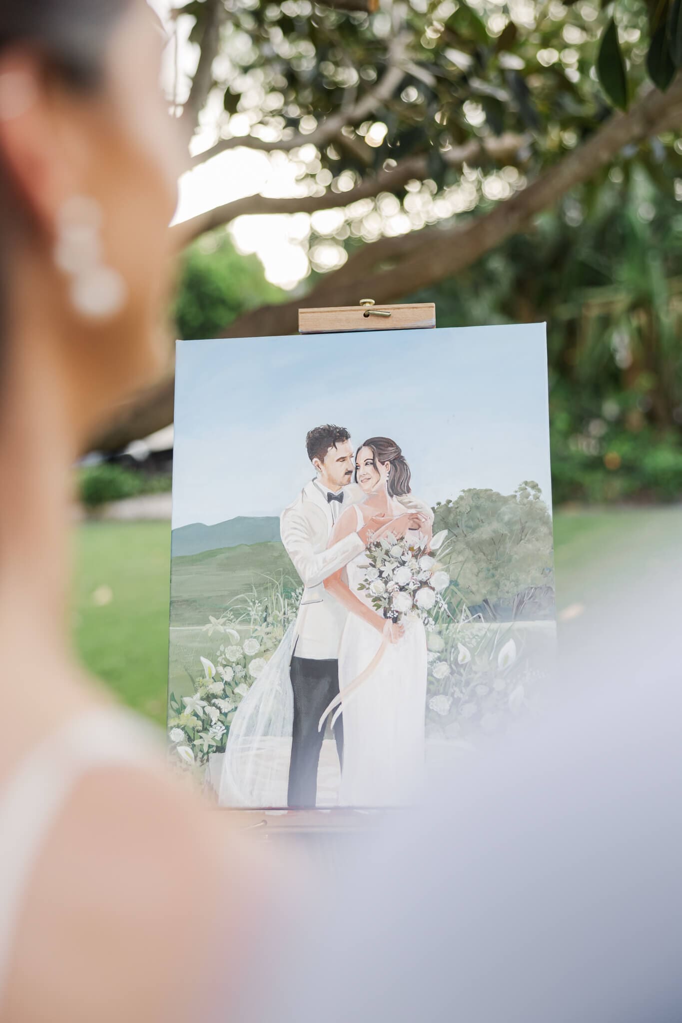 Finished product of a canvas painting of the bride and groom on their wedding day, created by Art by Joel.