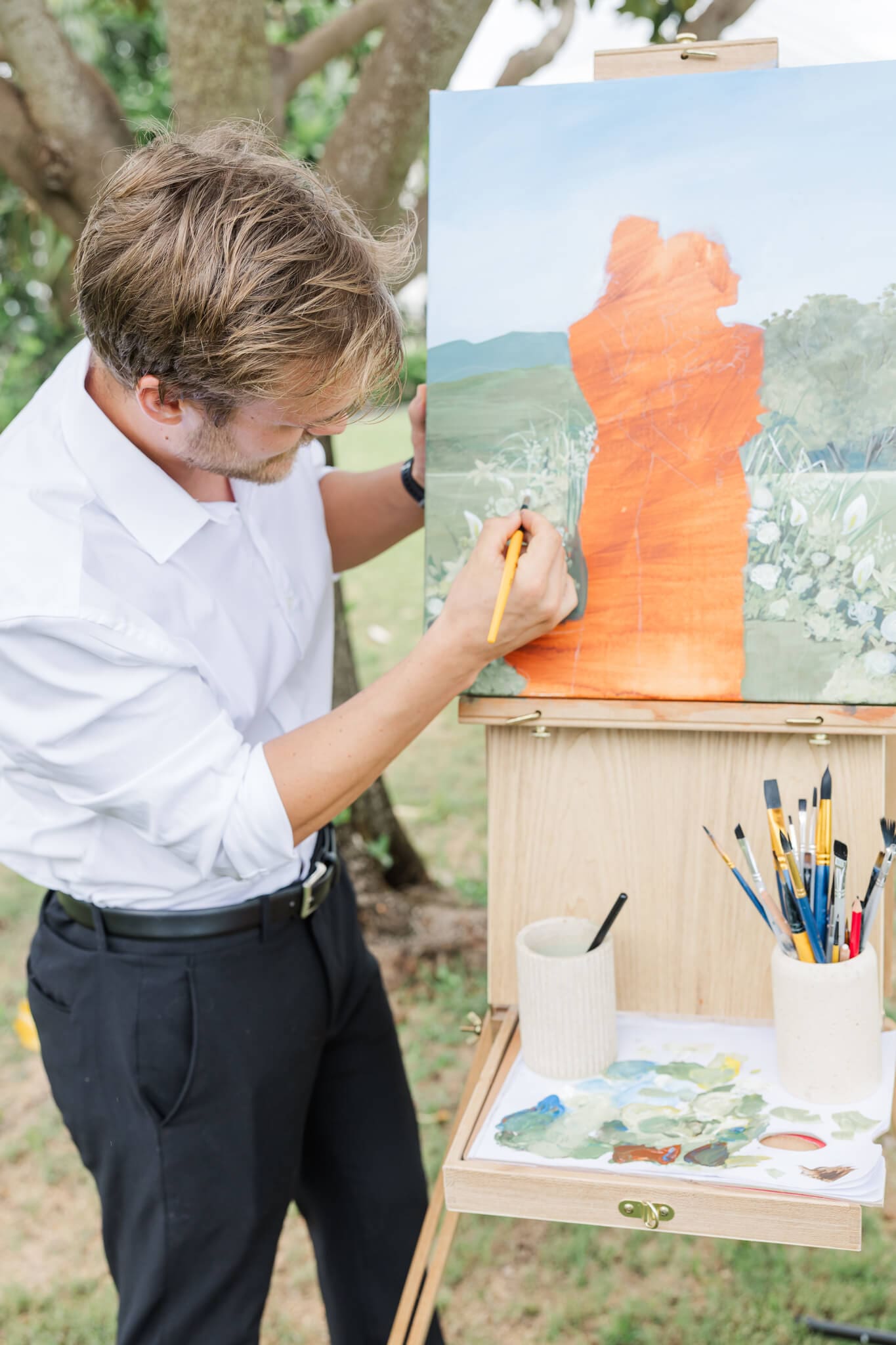 Art by Joel in action, painting a couple at  a Rockhampton and Yeppoon venue.