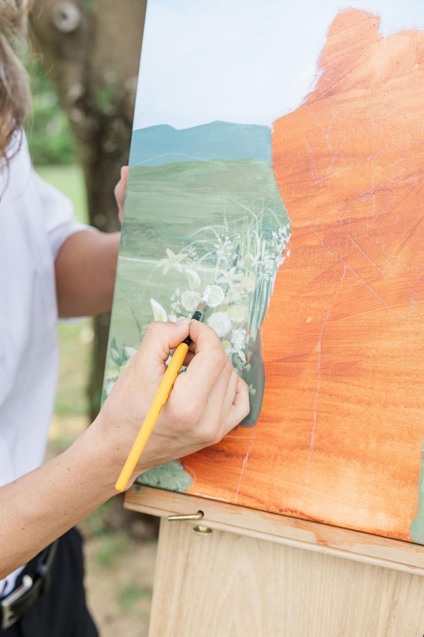 Art by Joel in action, painting a couple at  a Rockhampton and Yeppoon venue.