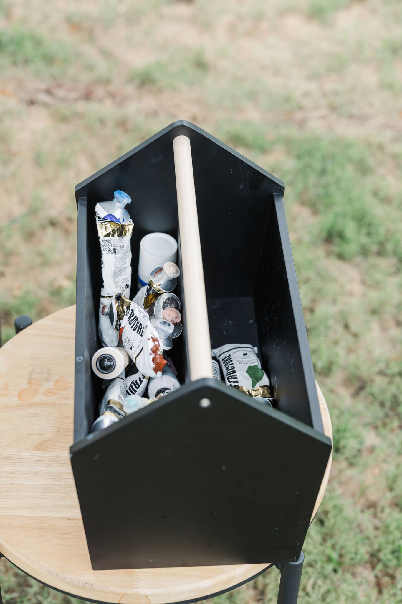 A black container of art paints.
