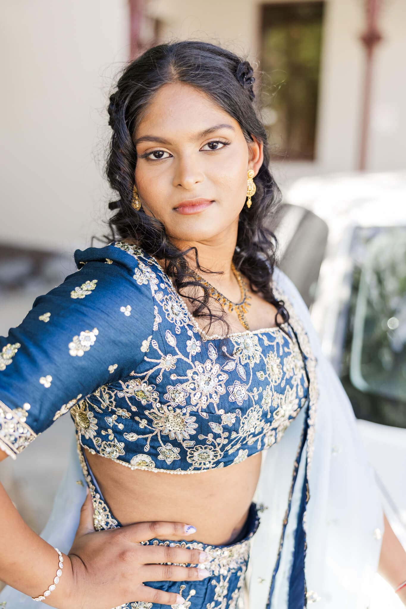 Beautiful formal photo of a high school graduate in Rockhampton, dressed in a blue and gold two piece gown.