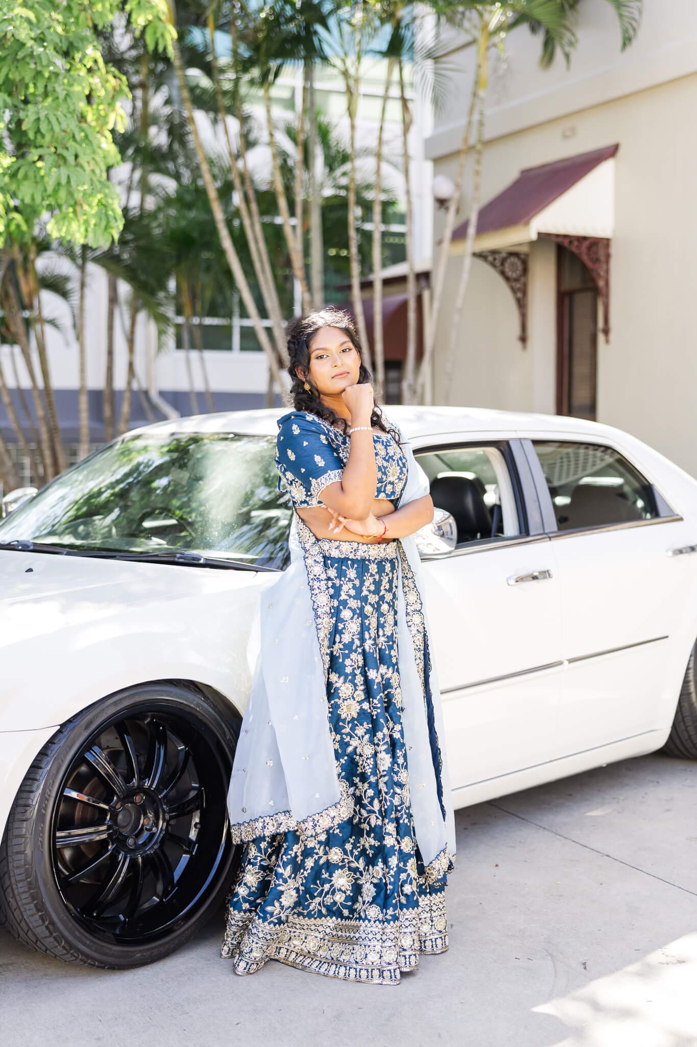 High school senior poses for her formal photos, next to her car hire in Rockhampton. Image by Julie-Anne Photography.