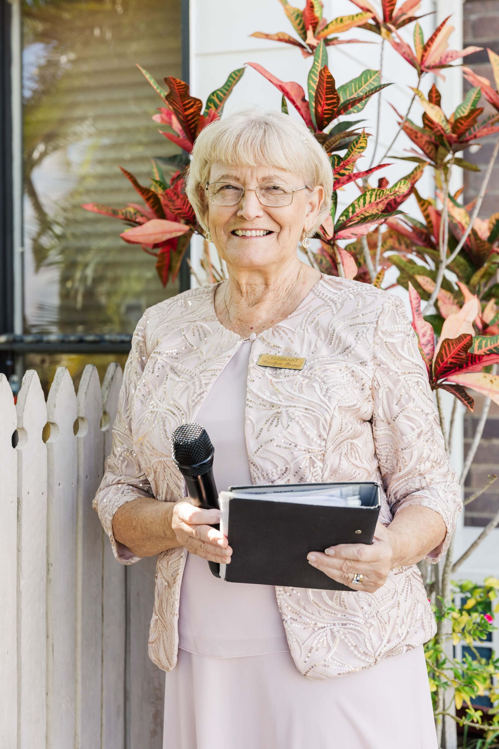 Marriage Celebrant, Carolynn Farmer stands waiting to serve Central Queensland wedding couples.