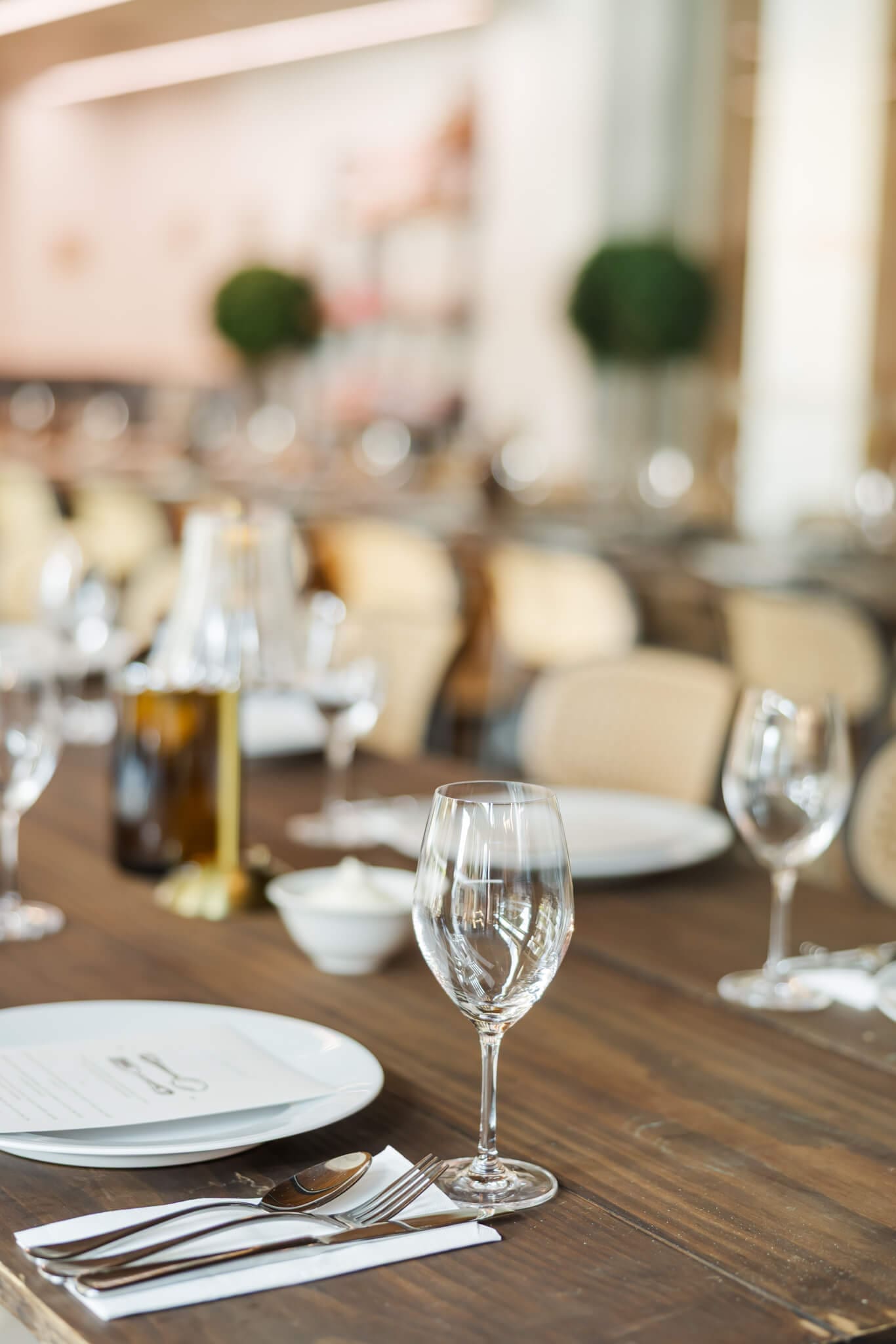 Elegant engagement party set up featuring wooden tables and beautiful lamp style centre pieces in a Rockhampton venue.