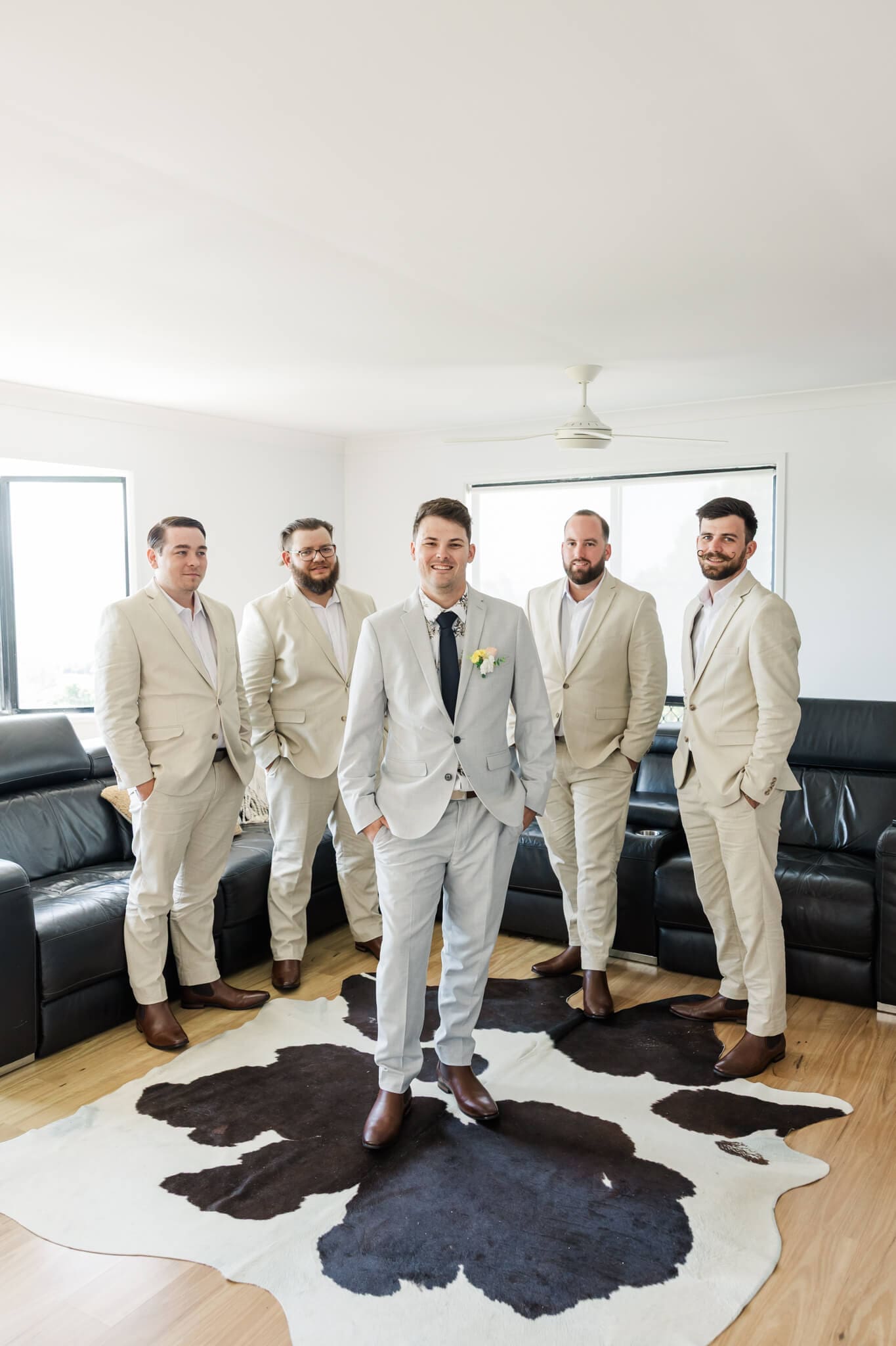The groom and his groomsmen pose for their photos, all dressed ready in their Rockhampton suits.
