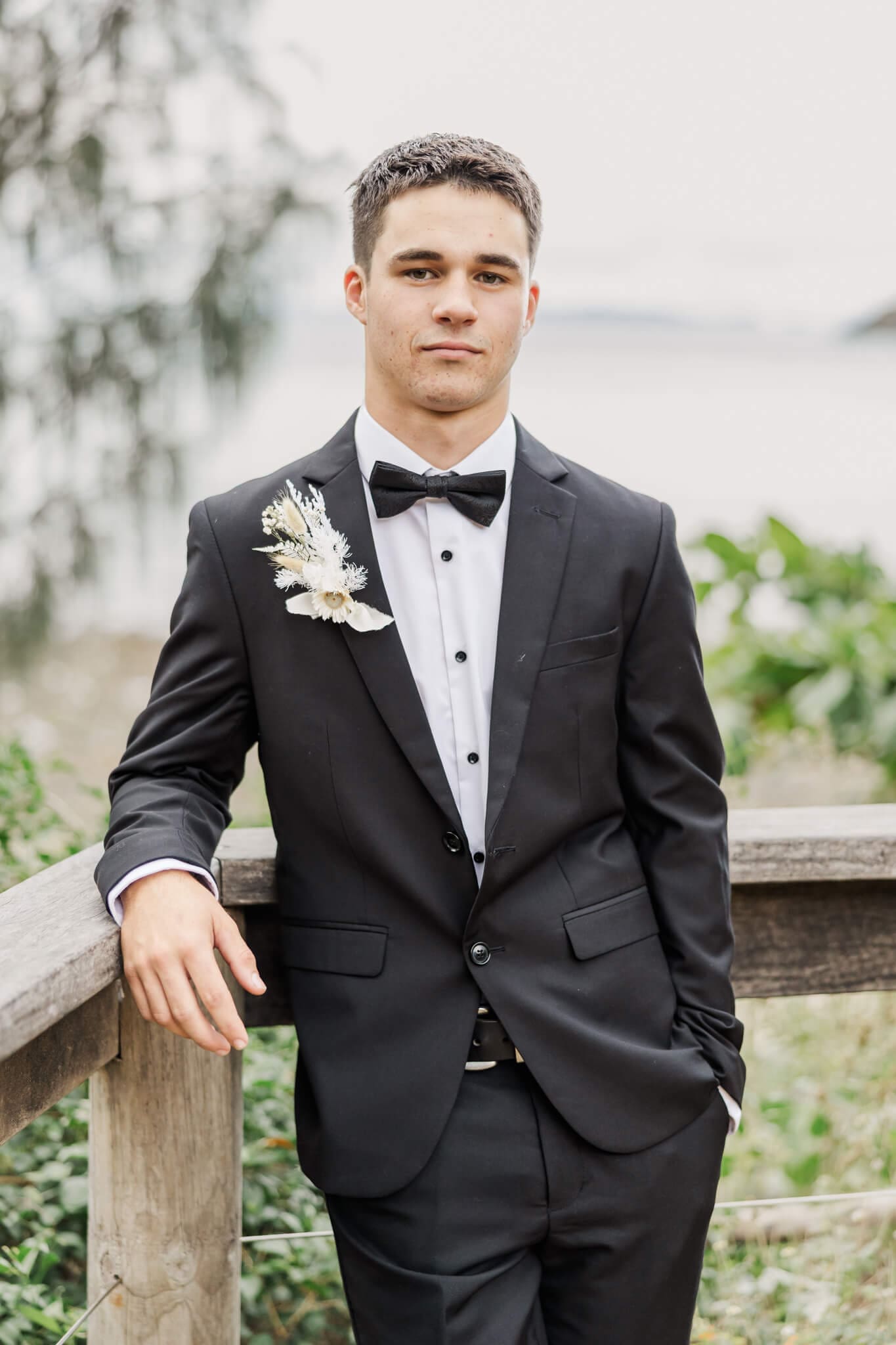 A young man wearing an outfit from Stewart's, a menswear store that sells suits in Rockhampton.