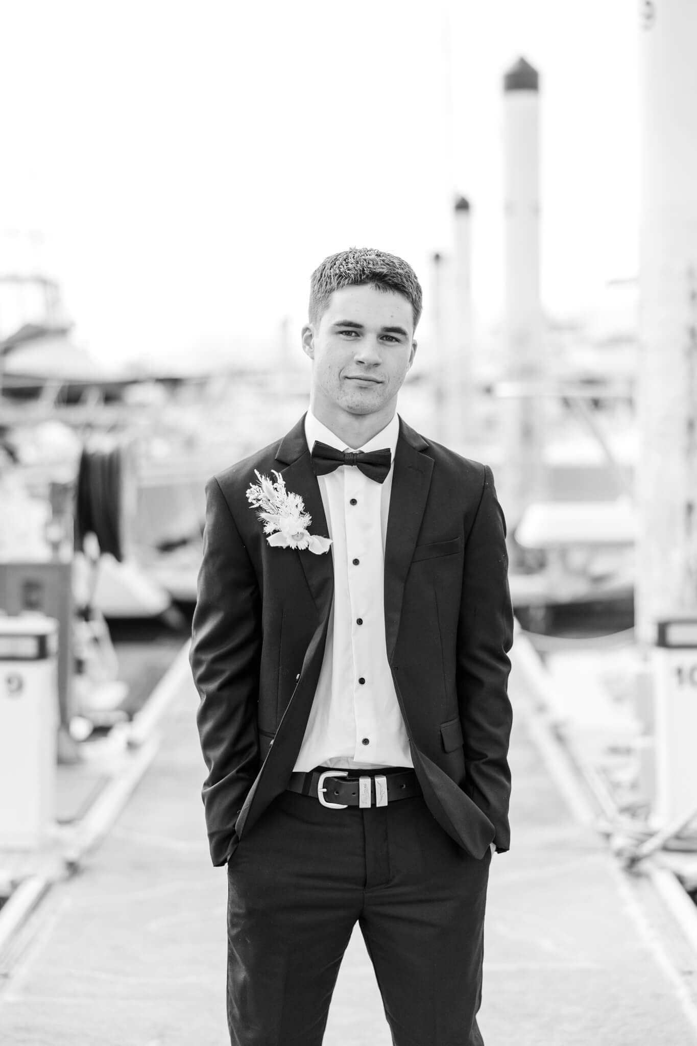A young man wearing an outfit from Stewart's, a menswear store that sells suits in Rockhampton.