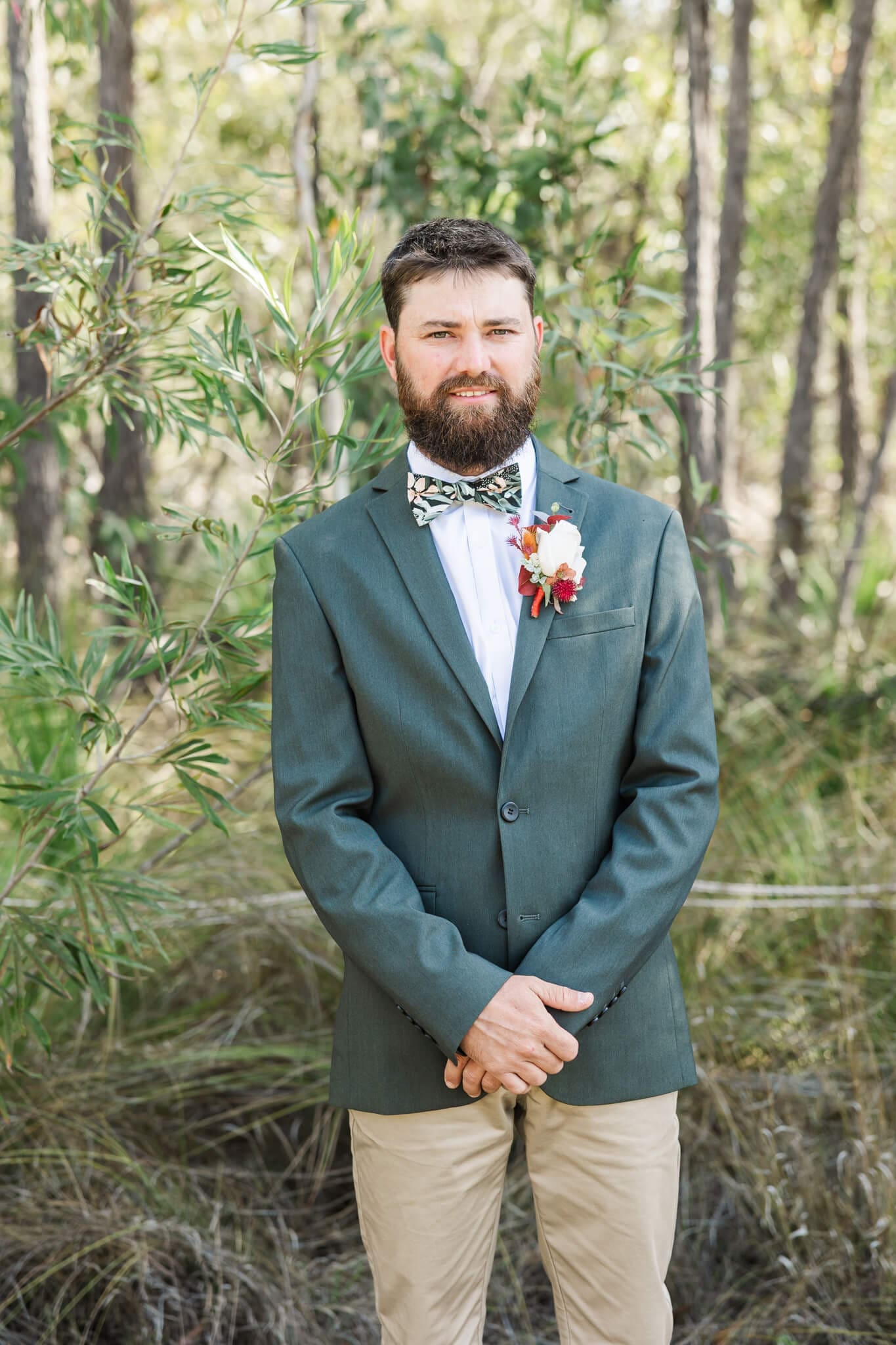 Portrait of the groom in amongst Australian bushland.