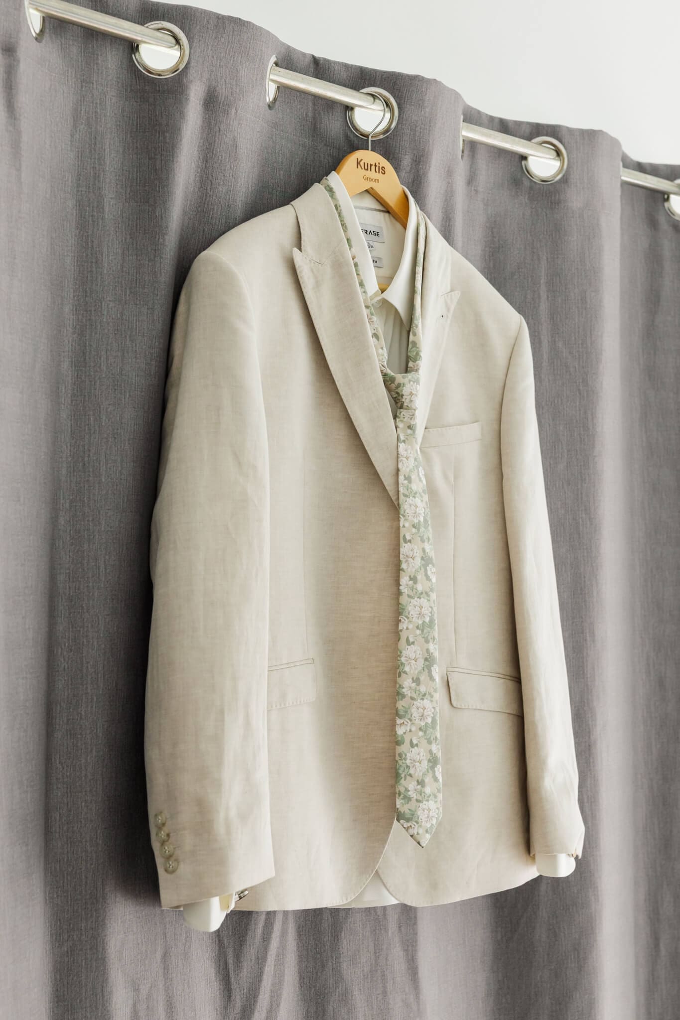 Suit hanging in an apartment located at The Haven Yeppoon, waiting for a groom to put it on for his wedding.