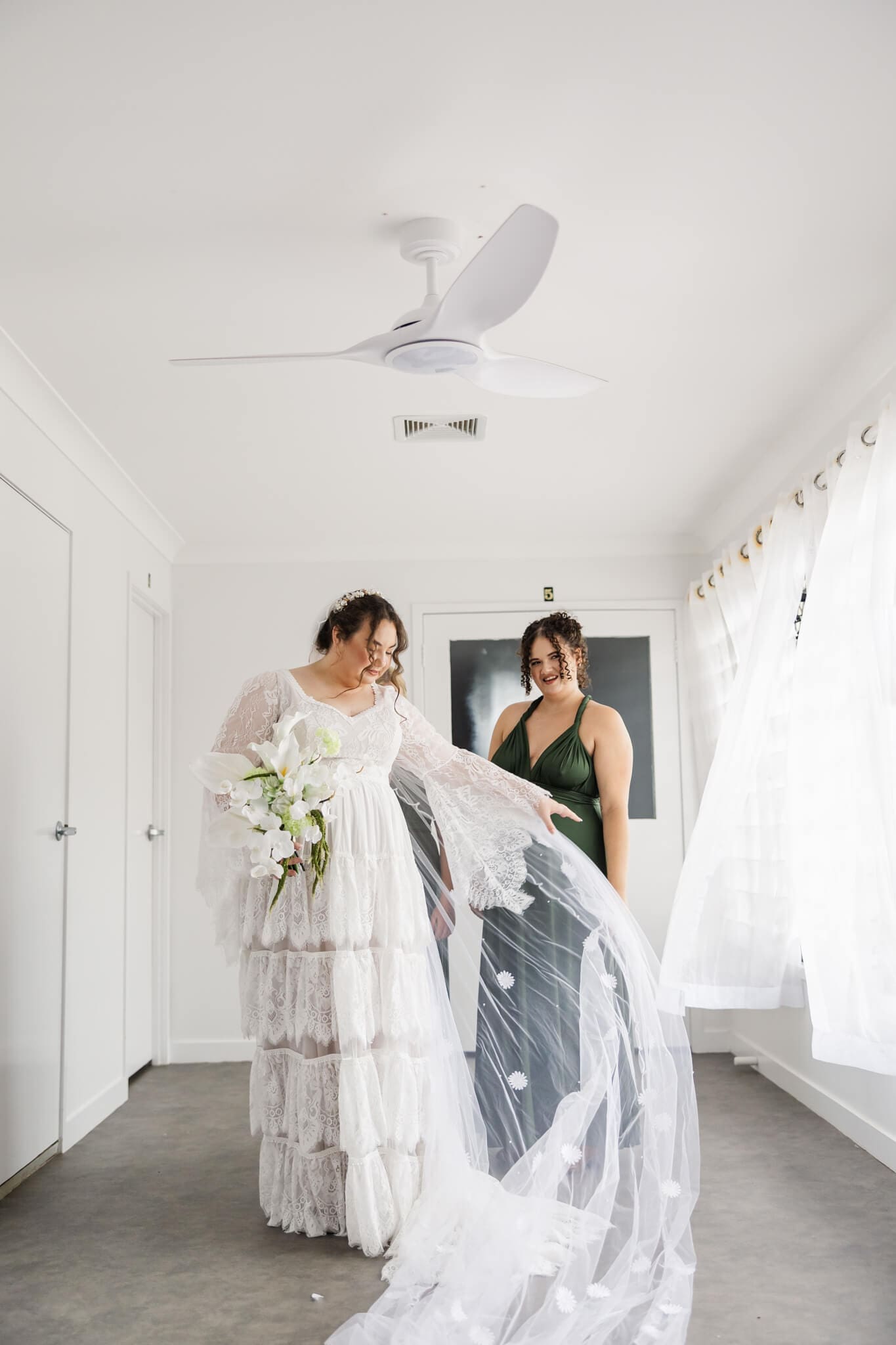 Bride getting ready with her bridesmaid at The Haven Yeppoon.