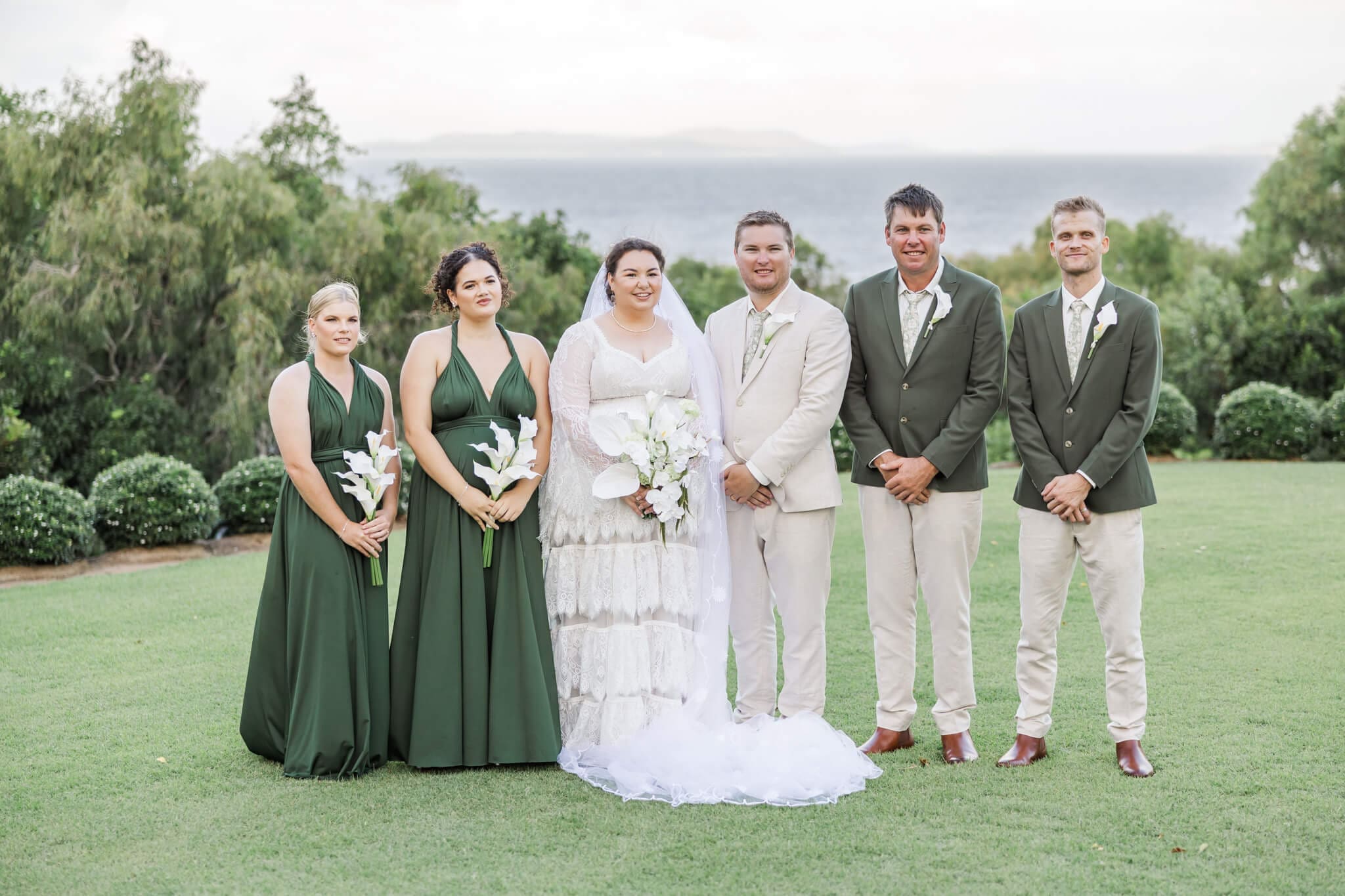 Bridal party pose for their group shot at The Haven Yeppoon, a wedding venue near Emu Park.